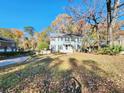 Two-story house with green siding, black shutters, and a landscaped lawn at 12 Monte Sano Dr, Hanahan, SC 29410