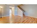 Living room with hardwood floors and access to other rooms at 1848 Mepkin Rd # 1043, Charleston, SC 29407