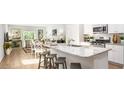 Open concept kitchen with island, granite countertops, and stainless steel appliances at 304 Tiliwa Street, Summerville, SC 29486