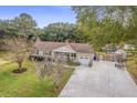 Aerial view of house, driveway, and nicely landscaped yard at 3591 Bayou Rd, Johns Island, SC 29455