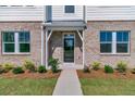 Townhouse entrance with landscaping and walkway at 5136 Double Eagle, Summerville, SC 29485