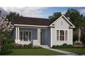 Blue craftsman style home with white trim and front porch at 719 Rumbling Leaf Ln, Summerville, SC 29486