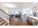 Open floor plan with hardwood floors and a view into the kitchen at 763 Maynard Ln, Summerville, SC 29486