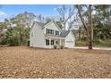 Two-story house with white siding, landscaping, and a large backyard at 929 Long Point Rd, Mount Pleasant, SC 29464