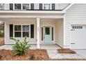 Front entrance with light teal door and white columns at 929 Long Point Rd, Mount Pleasant, SC 29464