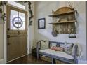 Charming entryway with rustic bench and coat rack at 1518 Old Rivers Gate Rd, Mount Pleasant, SC 29466