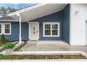 Front entrance with a white door and porch at 607 Mountain Pine Road, Moncks Corner, SC 29461
