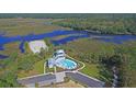 Community pool and clubhouse with waterfront access at 109 Peninsula Dr, Hollywood, SC 29470