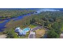 Community pool and clubhouse near a waterway at 109 Peninsula Dr, Hollywood, SC 29470
