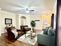 Spacious living room featuring hardwood floors, comfortable seating, and a ceiling fan at 202 Summer View Rd, Summerville, SC 29483