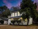 Two-story house with a front porch, attached garage, and landscaping at 238 Trickle Dr, Summerville, SC 29483