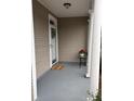 Front porch with a door, a small table, and a welcome mat at 9049 Delancey Cir, North Charleston, SC 29406