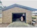 Attached garage with ample space for vehicles and storage at 208 Howard St, Varnville, SC 29944
