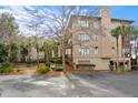 Building exterior with parking and landscaping; showcasing architectural details at 3017 Ocean Winds Dr, Seabrook Island, SC 29455