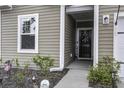 Front door entrance with a wreath and sidelights at 435 Eva St, Moncks Corner, SC 29461