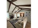 Spacious living room with vaulted ceiling, large sectional sofa, and fireplace at 141 Tall Pines Rd, Ladson, SC 29456