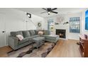 Living room with gray sectional sofa and a fireplace at 195 Pine Shadow Dr, Goose Creek, SC 29445