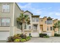 Three-story townhome with garage and landscaping at 2111 Tides End Rd, Charleston, SC 29412