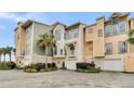 View of three-story townhomes and garages at 2111 Tides End Rd, Charleston, SC 29412