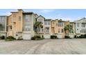 Exterior view of charming townhomes with garages at 2111 Tides End Rd, Charleston, SC 29412