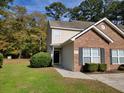 Attractive townhouse exterior with landscaping and driveway at 4743 Skillmaster Ct, North Charleston, SC 29418