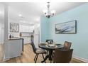 Charming dining area with a round table and kitchen access at 4796 Champion Way # C, North Charleston, SC 29418