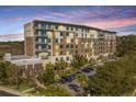 Tides IV building exterior, showcasing its architectural design and parking at 155 Wingo Way # 424, Mount Pleasant, SC 29464