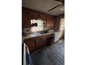 Kitchen with wood cabinets and vintage appliances at 206 Palmetto St, Moncks Corner, SC 29461