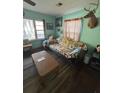 Living room featuring hardwood floors and a vintage sofa at 206 Palmetto St, Moncks Corner, SC 29461
