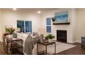 Spacious living room with fireplace, hardwood floors, and large windows at 219 Darby Meadow Ln, Ridgeville, SC 29472