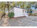 White craftsman style home with fenced backyard and mature trees at 2208 Bailey Dr, North Charleston, SC 29405