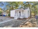 Recently remodeled home with a charming front porch and walkway at 2208 Bailey Dr, North Charleston, SC 29405