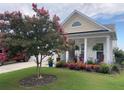 Charming curb appeal with a crape myrtle tree and well-maintained landscaping at 506 Tranquil Waters Way, Summerville, SC 29486