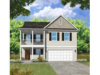 Two-story home with beige siding, dark shutters, and a two car garage at 52 Westfield Dr, Ridgeville, SC 29472