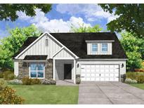 Two-story craftsman style home with stone accents and two-car garage at 39 Waycross Dr, Ridgeville, SC 29472