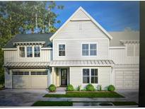Two-story farmhouse-style home with gray roof and attached two-car garage at 516 Hayes Park Blvd # 1, Johns Island, SC 29455
