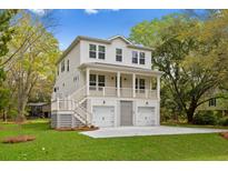 Two-story house with double garage and front porch at 1075 Capersview Ct, Awendaw, SC 29429