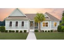 Charming one-story home with light gray siding, a walkway, and lush landscaping at 615 Faulkner Dr, Mount Pleasant, SC 29466