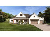 Modern farmhouse exterior with a two-car garage and landscaped yard at 635 Faulkner Dr, Mount Pleasant, SC 29466