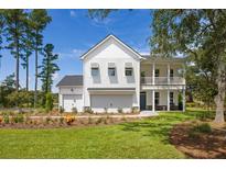 Two story home with large front yard and two car garage at 5000 Middleton Dr, Goose Creek, SC 29445