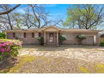 Brick ranch house with a front yard at 1157 Symmes Dr, Charleston, SC 29407