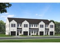 Four attached townhouses with farmhouse style exteriors and black garages at 214 Greenling St, Goose Creek, SC 29445
