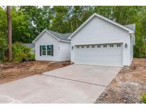 New construction home with white siding and a two-car garage at 105 Equestrian Ct, Summerville, SC 29486