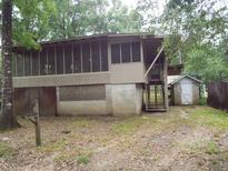 Elevated home with screened porch and detached shed at 31 Hannibal Dr, Ridgeville, SC 29472