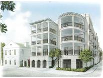 Three-story building with balconies and white columns at 5 Middle Atlantic Wharf # 3A, Charleston, SC 29401