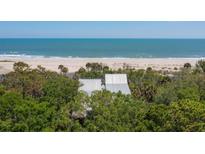 Oceanfront property with private boardwalk to beach access at 403 Pelican Flight Dr, Dewees Island, SC 29451