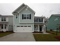Two-story house with light blue siding, white trim, and a two-car garage at 508 Eagleview Dr, Moncks Corner, SC 29461