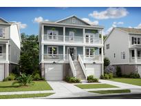 Two-story home with front porch and attached garage at 1647 Cultivation Ln # 451, Mount Pleasant, SC 29466