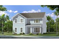 Two-story light blue house with gray metal roof and landscaping at 3 Trailhead Ln, Awendaw, SC 29429