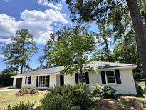 Charming brick ranch home with a newly landscaped yard at 401 Constance St, Walterboro, SC 29488
